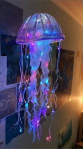 Colorful DIY jellyfish craft made from materials like plastic and craft paper.